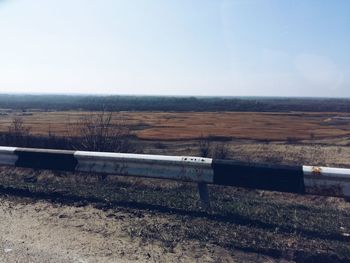 Scenic view of field against clear sky