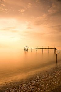 Scenic view of sea against sky at sunset