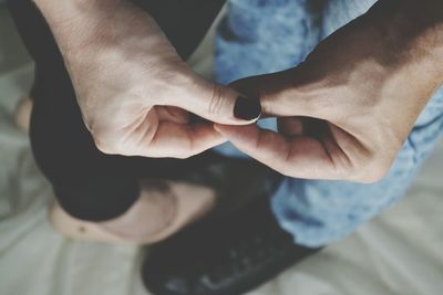 Low section of man wearing shoes while standing on dirty steps