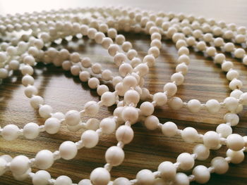 High angle view of white candies on table