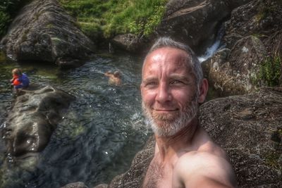 Portrait of man swimming in sea