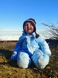 Full length of cute girl on field against clear blue sky