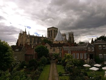 York minster and buildings against cloudy sky