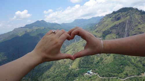 Human hands forming heart shape