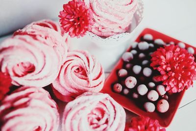 Close-up of pink roses on table