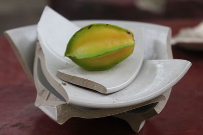 Close-up of fruits in plate on table