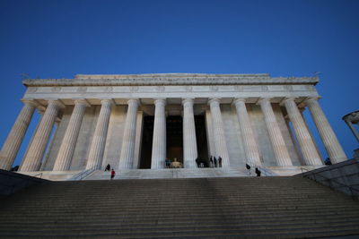 Low angle view of people on steps