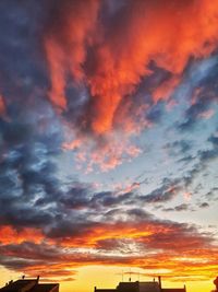 Low angle view of dramatic sky during sunset