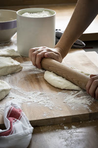 Midsection of preparing food on table