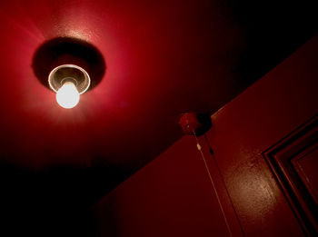 Low angle view of illuminated light bulb