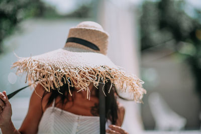 Rear view of woman wearing hat