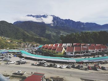 High angle view of buildings in mountains against sky
