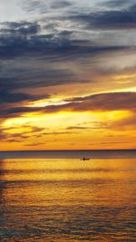 Scenic view of sea against sky at sunset