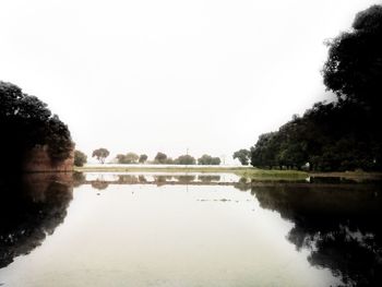 Scenic view of calm lake against sky