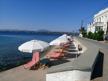 High angle view of sea with umbrellas in background