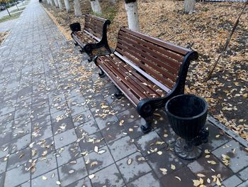 High angle view of empty bench in park during autumn