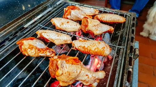 High angle view of meat on barbecue grill