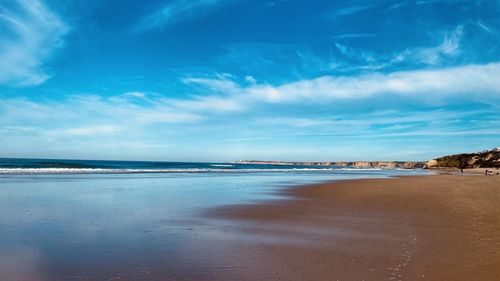 Scenic view of beach against sky