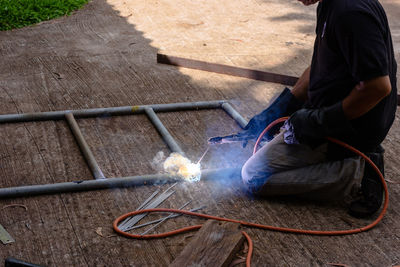 Low section of man working
