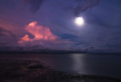 Scenic view of sea against sky at night