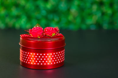 Close-up of lit candle on table