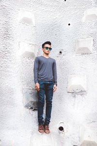 Portrait of young man standing outdoors