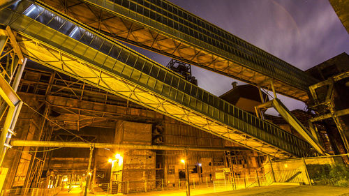 Low angle view of illuminated city at night