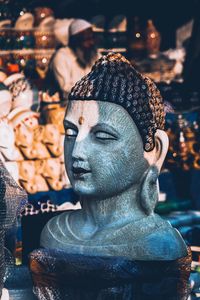 Close-up of buddha statue in store