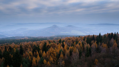 Scenic view of mountains against cloudy sky