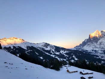 Scenic view of snowcapped mountains against clear sky