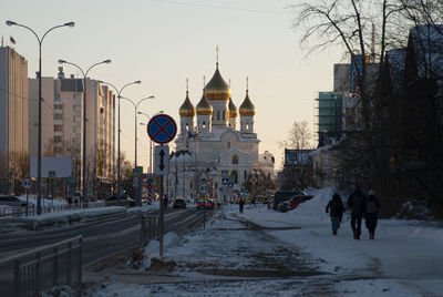 The street leading to the cathedral in a contrasting warm sky with gilded domes