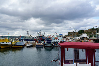 Boats moored at harbor