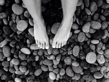 Low section of woman standing on tiled floor