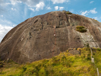 Low angle view of rock formations against sky