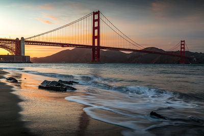 View of suspension bridge at sunset