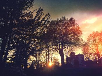 Low angle view of built structure at sunset