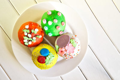 High angle view of candies in plate on table