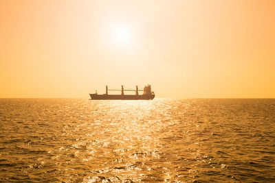 Silhouette of a cargo ship