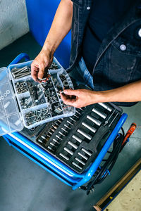 High angle view of man working in garage