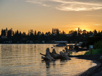 Scenic view of lake against sky during sunset