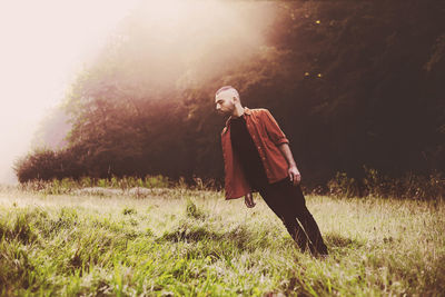 Woman standing on grassy field