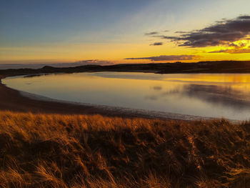 Scenic view of sunset over river