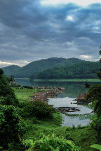 Scenic view of lake against cloudy sky