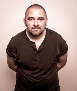 Portrait of man wearing mask against white background