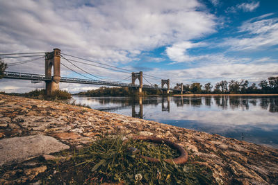 Bridge over river against sky