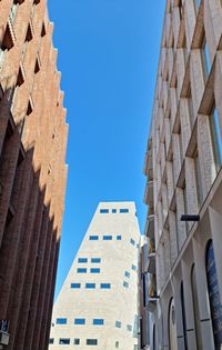 Low angle view of skyscrapers against clear sky