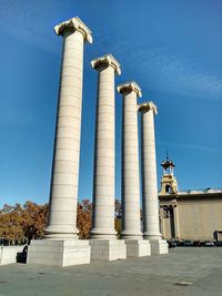 Low angle view of cross against blue sky