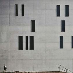 Woman standing in front of building