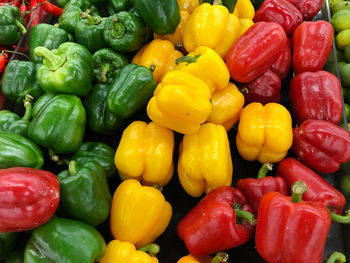 Full frame shot of multi colored bell peppers at market