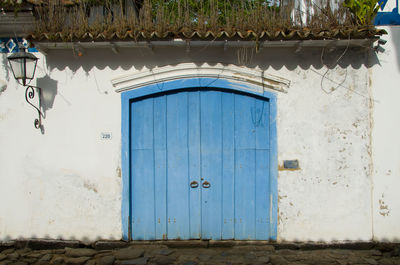 Closed blue door of building